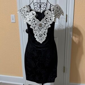 Elegant Black Dress with White Lace Detail